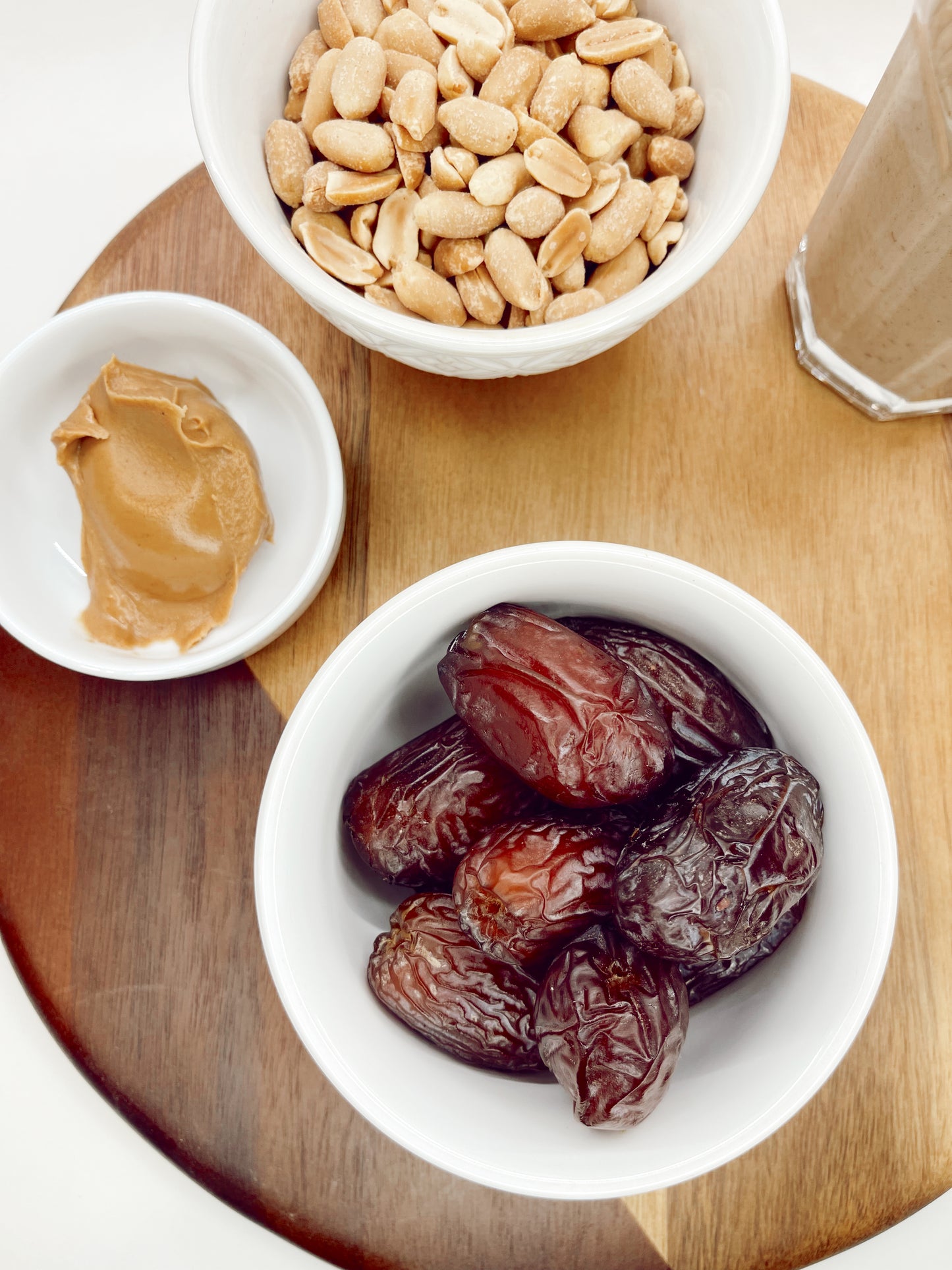 Overhead view of Large Organic Medjool Dates in a bowl, showcasing their organic luster and size.