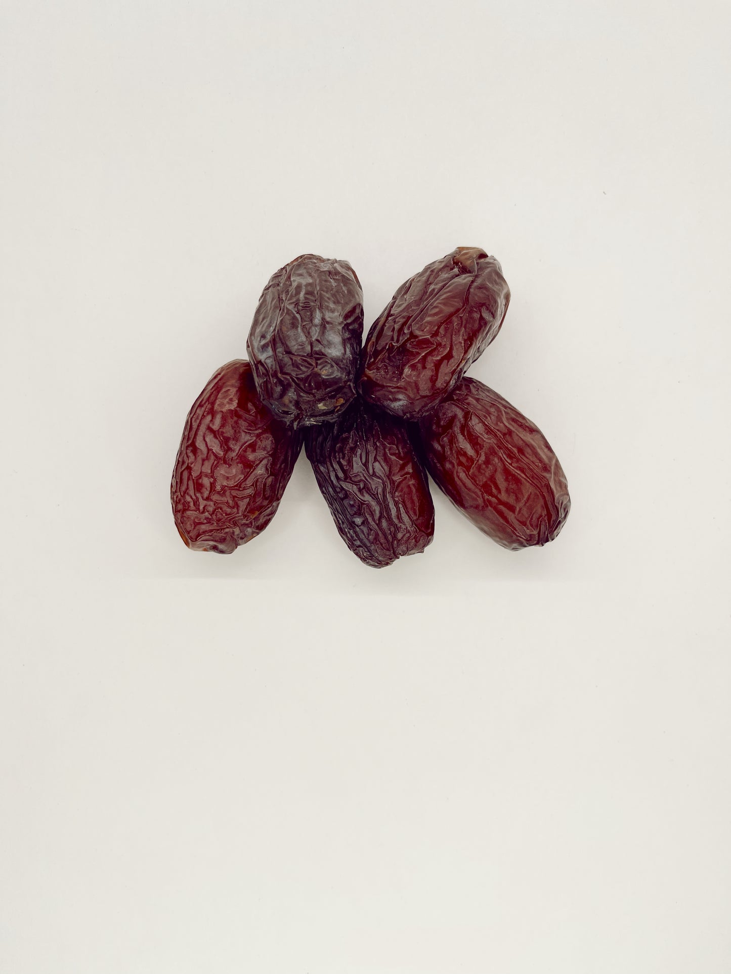 Overhead shot of Jumbo Organic Medjool Dates, emphasizing their natural appearance.